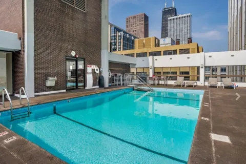 an aerial view of a house with swimming pool
