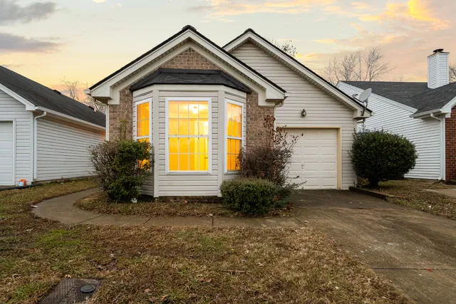 a front view of house with a yard