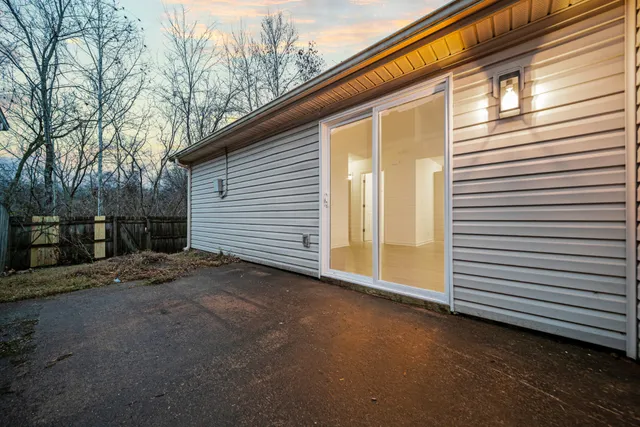 a view of a house with a yard and garage