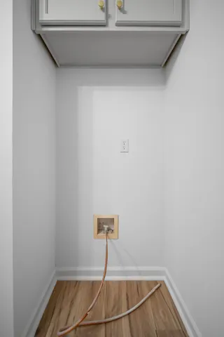 a room with a table and a chandelier