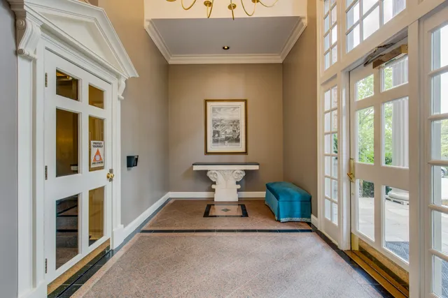 a view of a entryway with furniture and windows