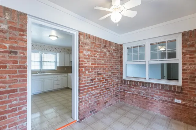 a view of a backyard with wooden fence