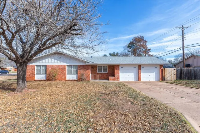 a brick house with a large window