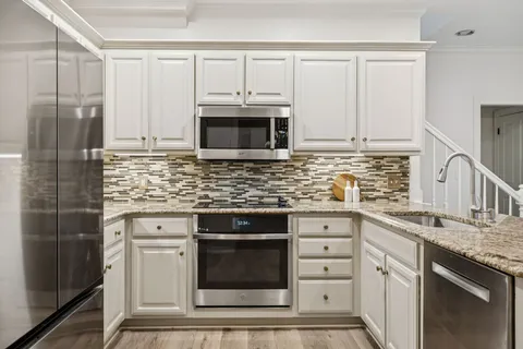 a bath tub sitting next to a window