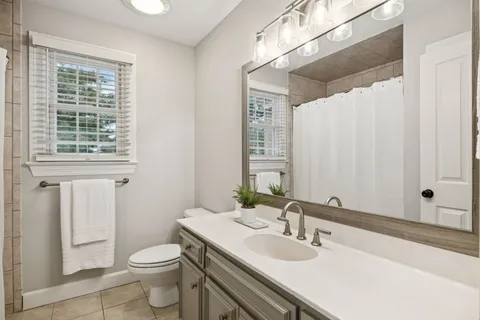 a view of a backyard with sitting area and a garden