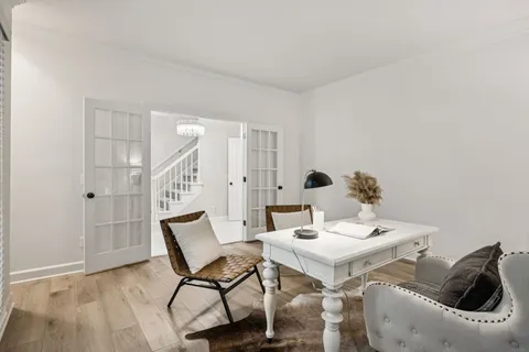 a view of a livingroom with furniture and lounge chair