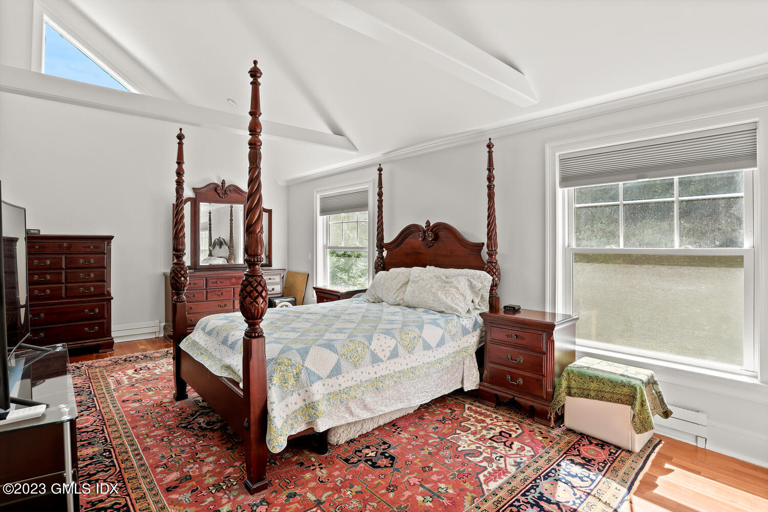 30 Sinawoy Road Cos Cob, CT 06807 - Photo 14 of 21 a bedroom with a bed wooden floor and a window