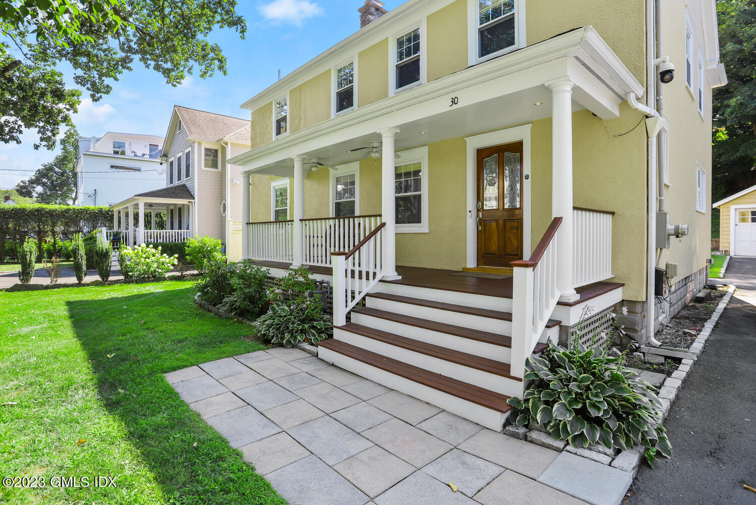 30 Sinawoy Road Cos Cob, CT 06807 - Photo 2 of 21 a front view of a house with garden