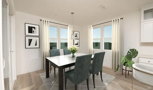 a view of a dining room with furniture window and outside view