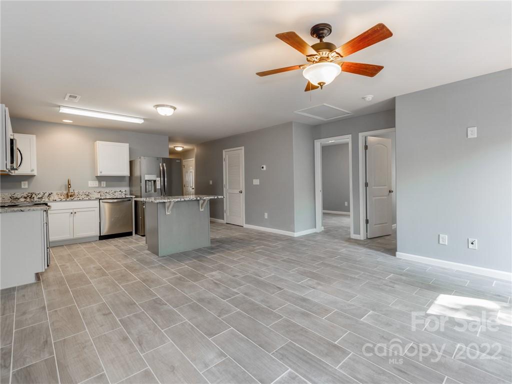 1032 Unity Pointe Lane Kings Mountain, NC 28086 - Photo 17 of 29 a view of a kitchen with a sink appliances and a living room
