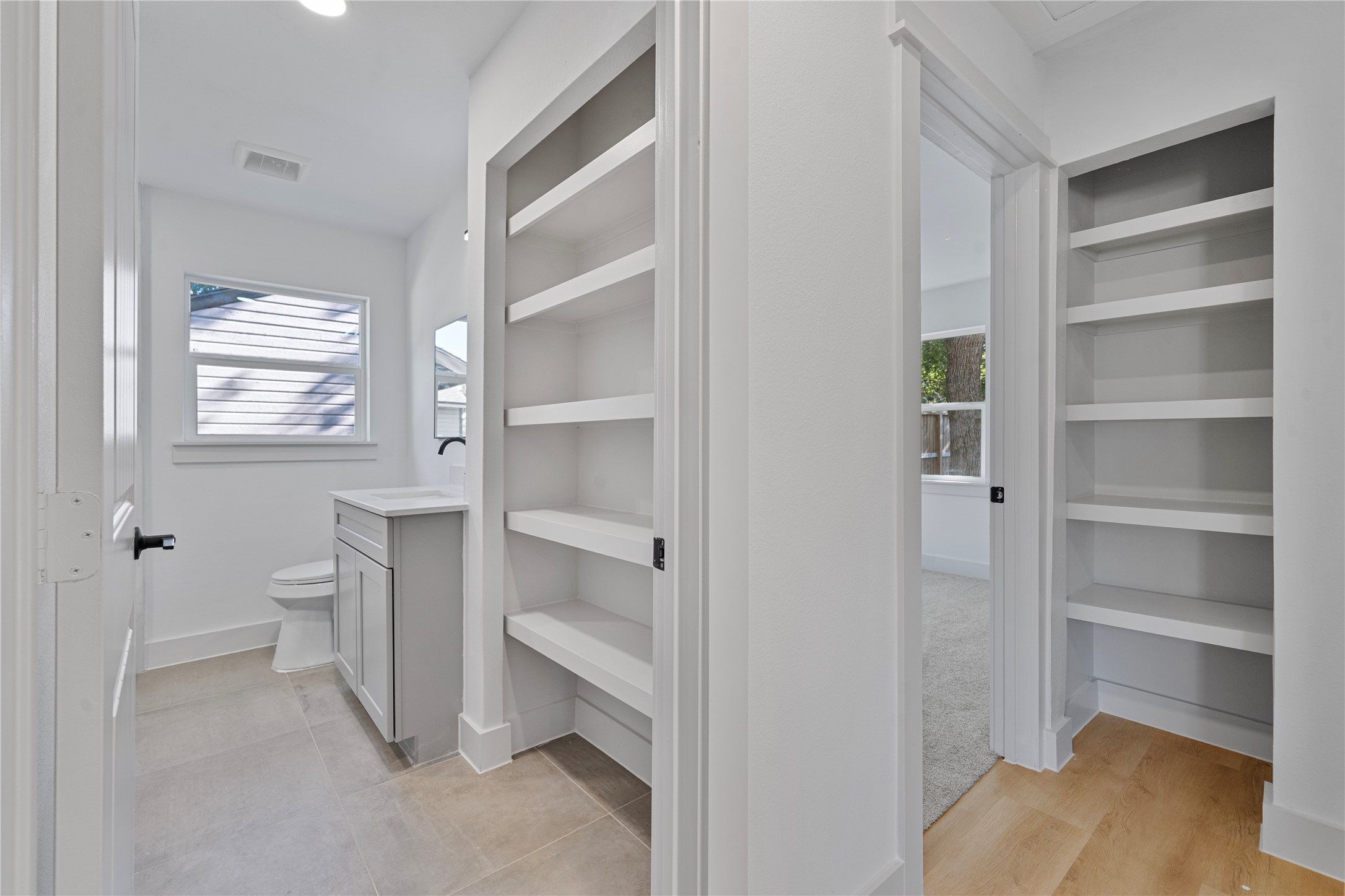 5114 Keystone Street Houston, TX 77021 - Photo 19 of 29 a view of walk in closet with empty racks