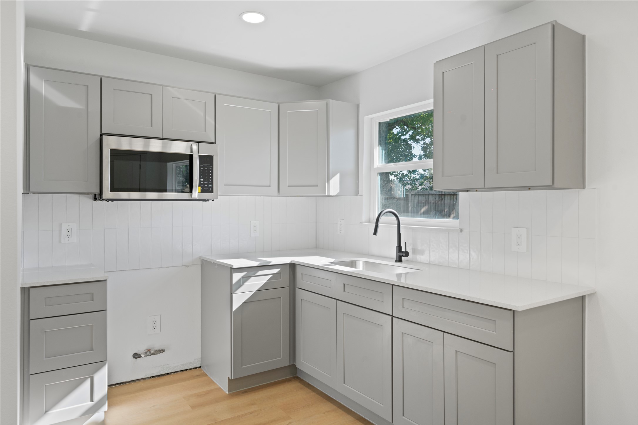 5114 Keystone Street Houston, TX 77021 - Photo 25 of 29 a kitchen with a sink and cabinets