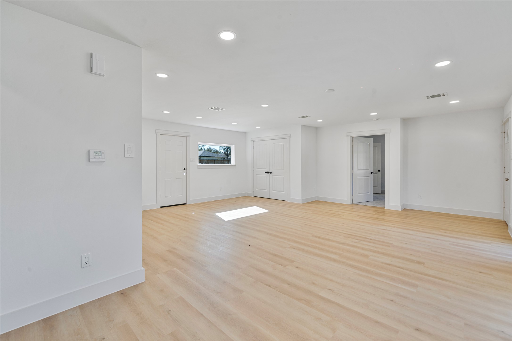 5114 Keystone Street Houston, TX 77021 - Photo 6 of 29 a view of empty room with wooden floor