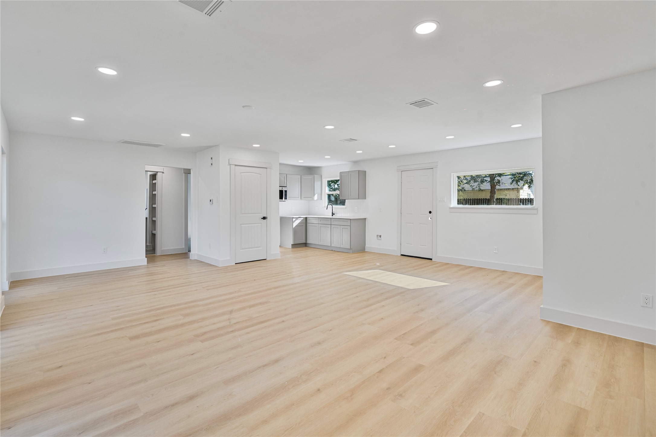 5114 Keystone Street Houston, TX 77021 - Photo 7 of 29 a view of empty room with wooden floor