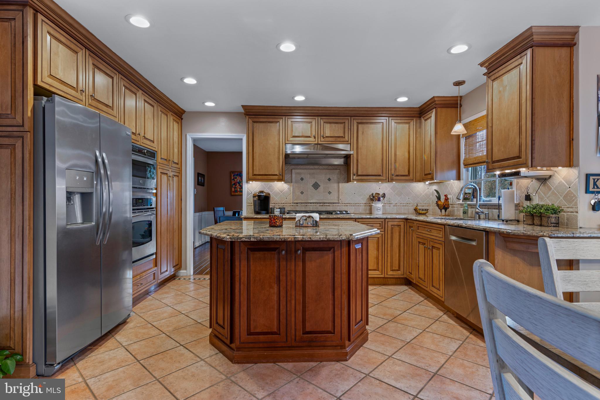 1586 Salomon Lane Chesterbrook, PA 19087 - Photo 16 of 47 a kitchen with stainless steel appliances granite countertop a refrigerator a sink and a stove