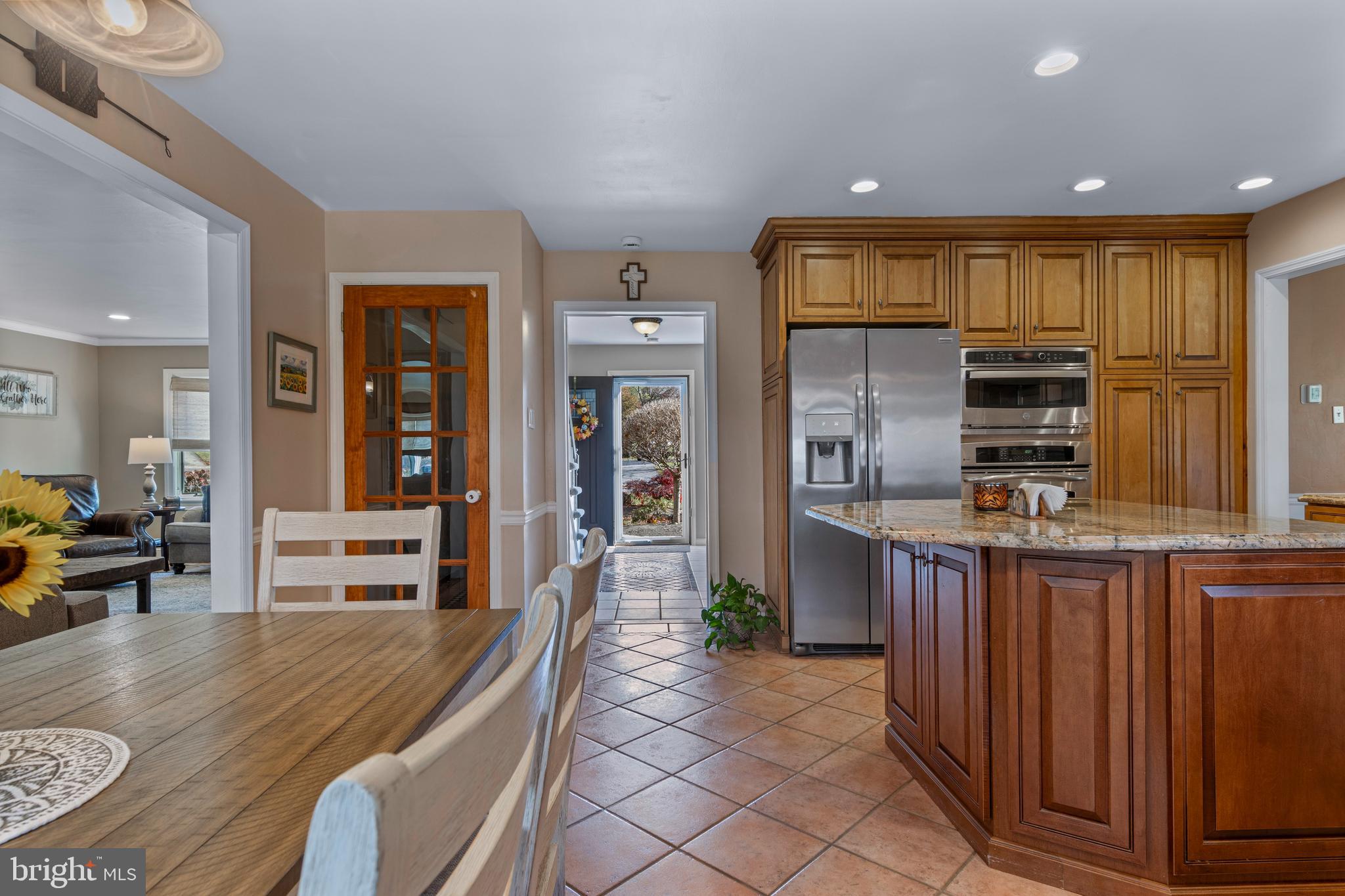 1586 Salomon Lane Chesterbrook, PA 19087 - Photo 17 of 47 a kitchen with stainless steel appliances granite countertop a refrigerator a stove and a sink with wooden floor