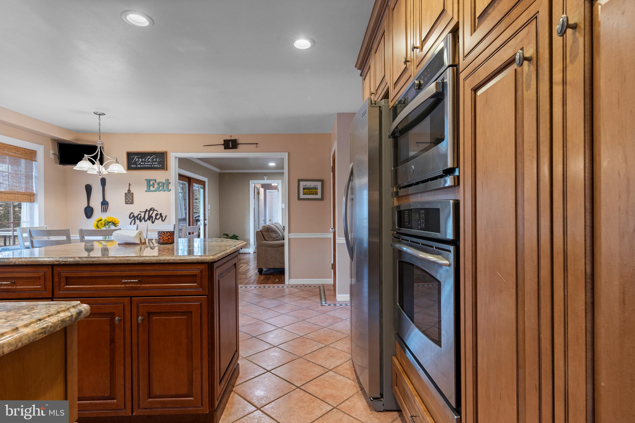 1586 Salomon Lane Chesterbrook, PA 19087 - Photo 18 of 47 a kitchen with kitchen island a sink stainless steel appliances and cabinets