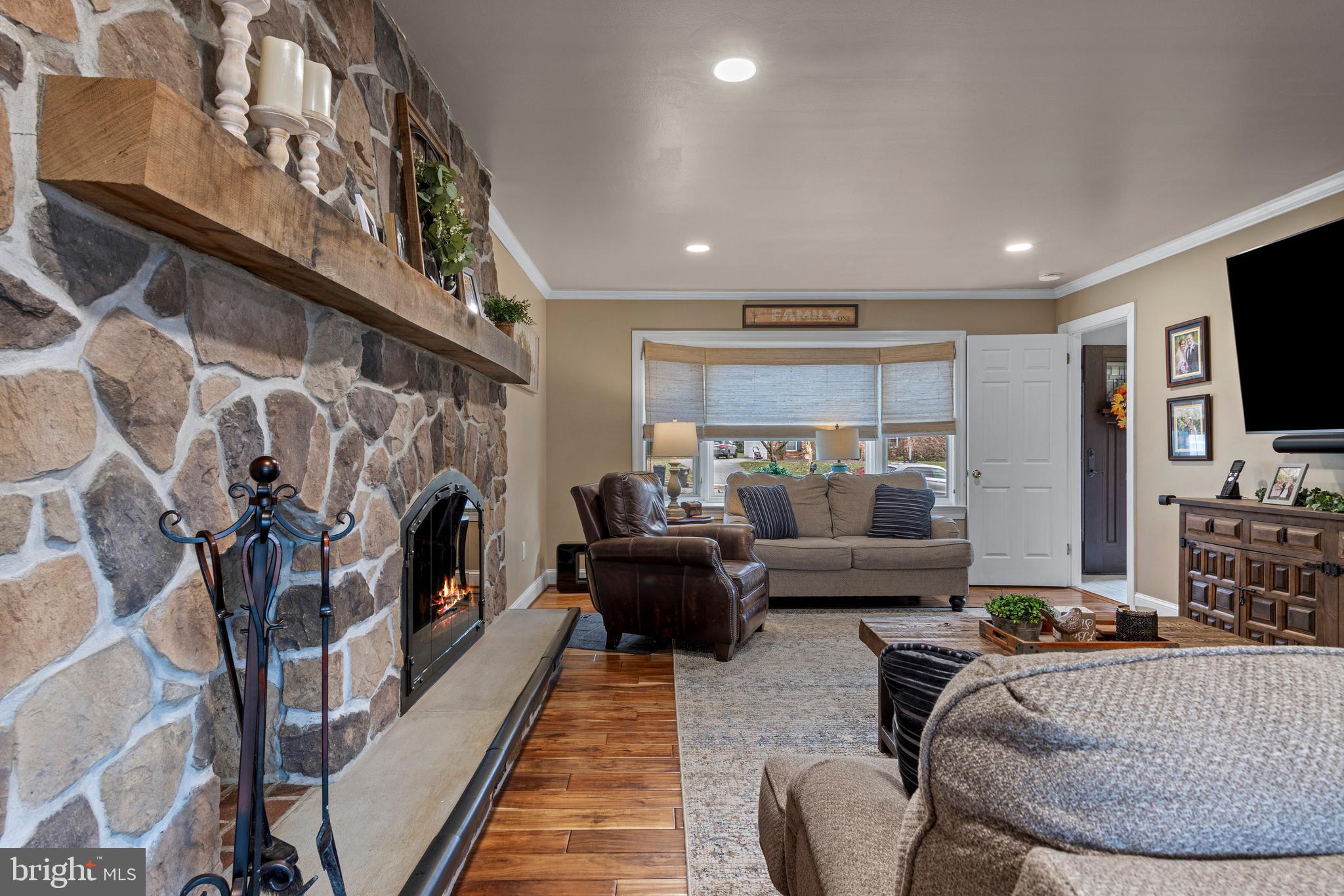 1586 Salomon Lane Chesterbrook, PA 19087 - Photo 27 of 47 a living room with furniture and a fireplace