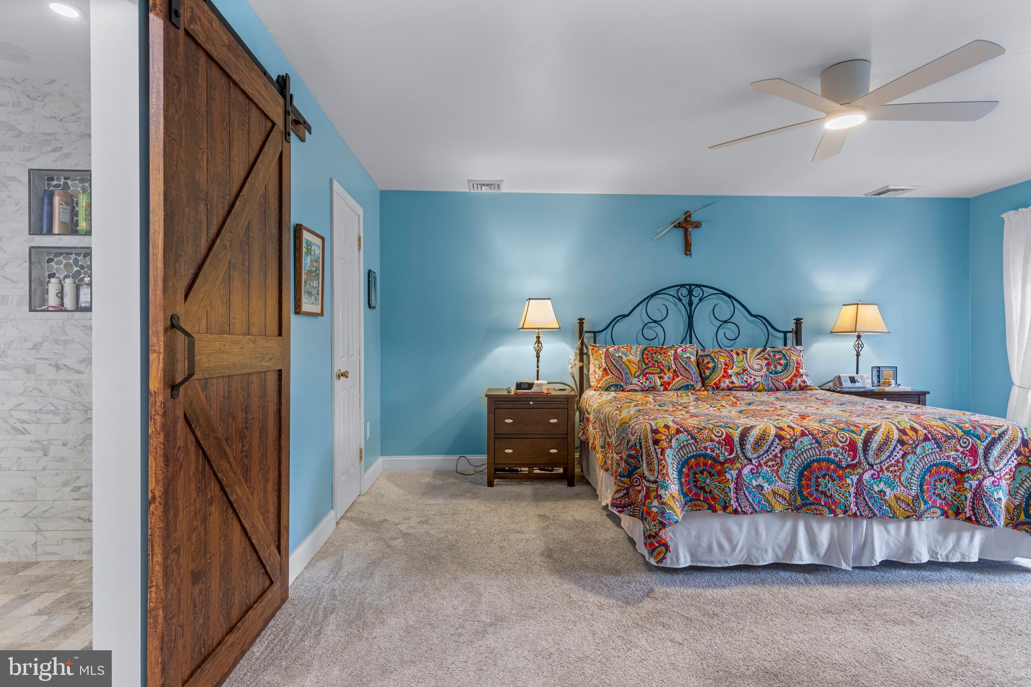 1586 Salomon Lane Chesterbrook, PA 19087 - Photo 36 of 47 a bedroom with a bed and a chandelier