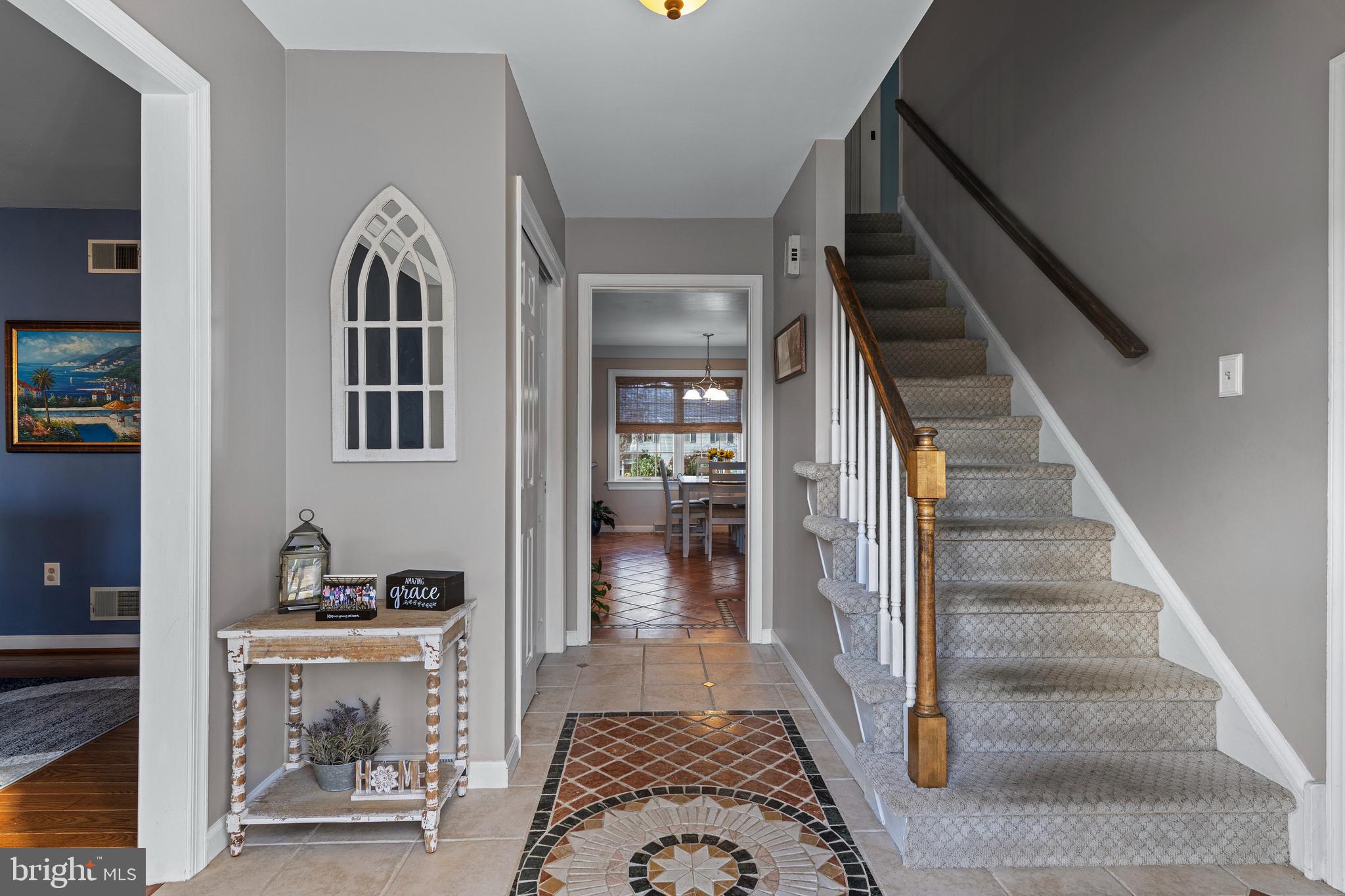 1586 Salomon Lane Chesterbrook, PA 19087 - Photo 8 of 47 a view of a hallway with wooden floor and staircase