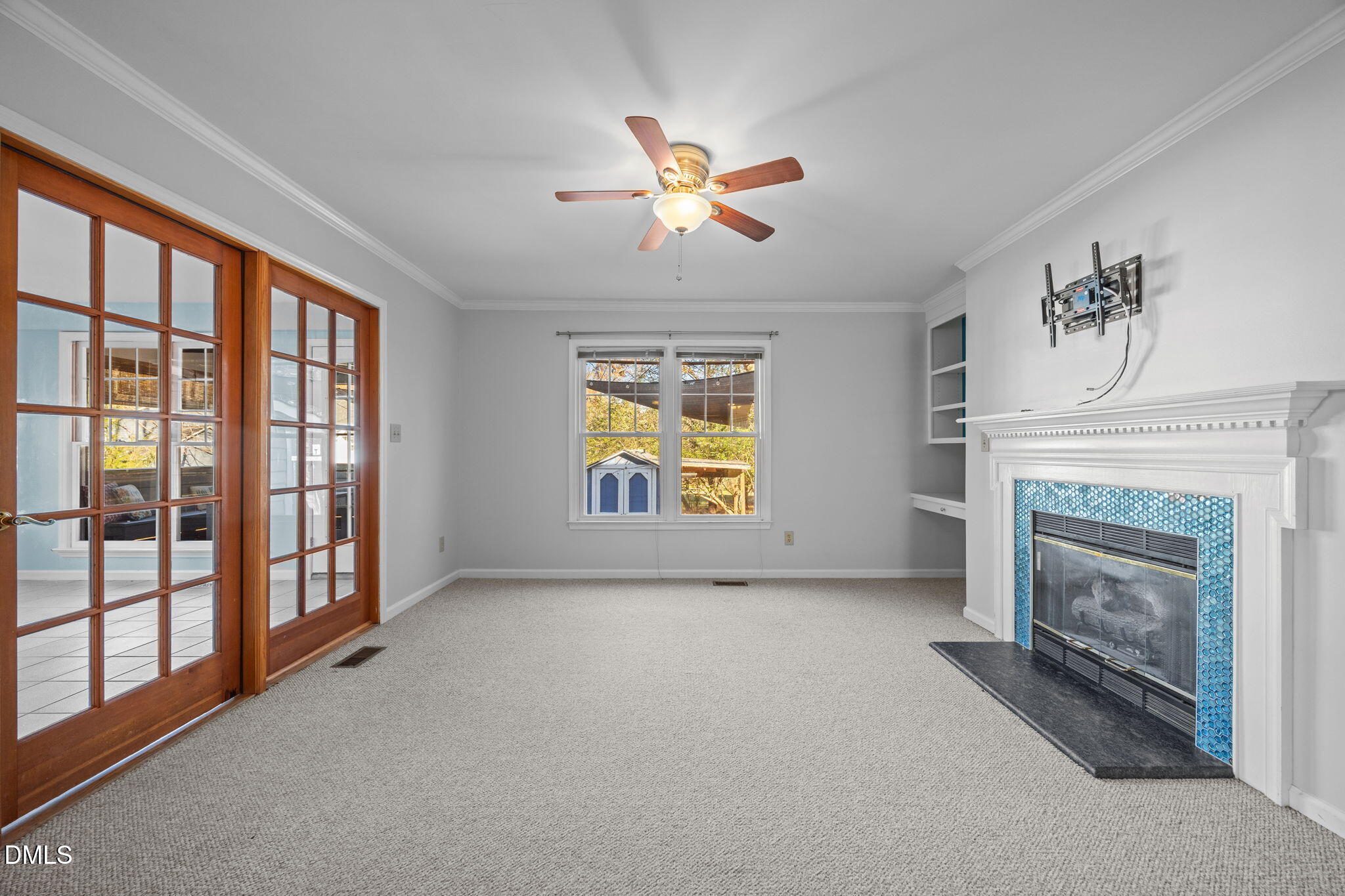 2214 Pathway Drive Chapel Hill, NC 27516 - Photo 8 of 34 a view of empty room with fireplace and fan