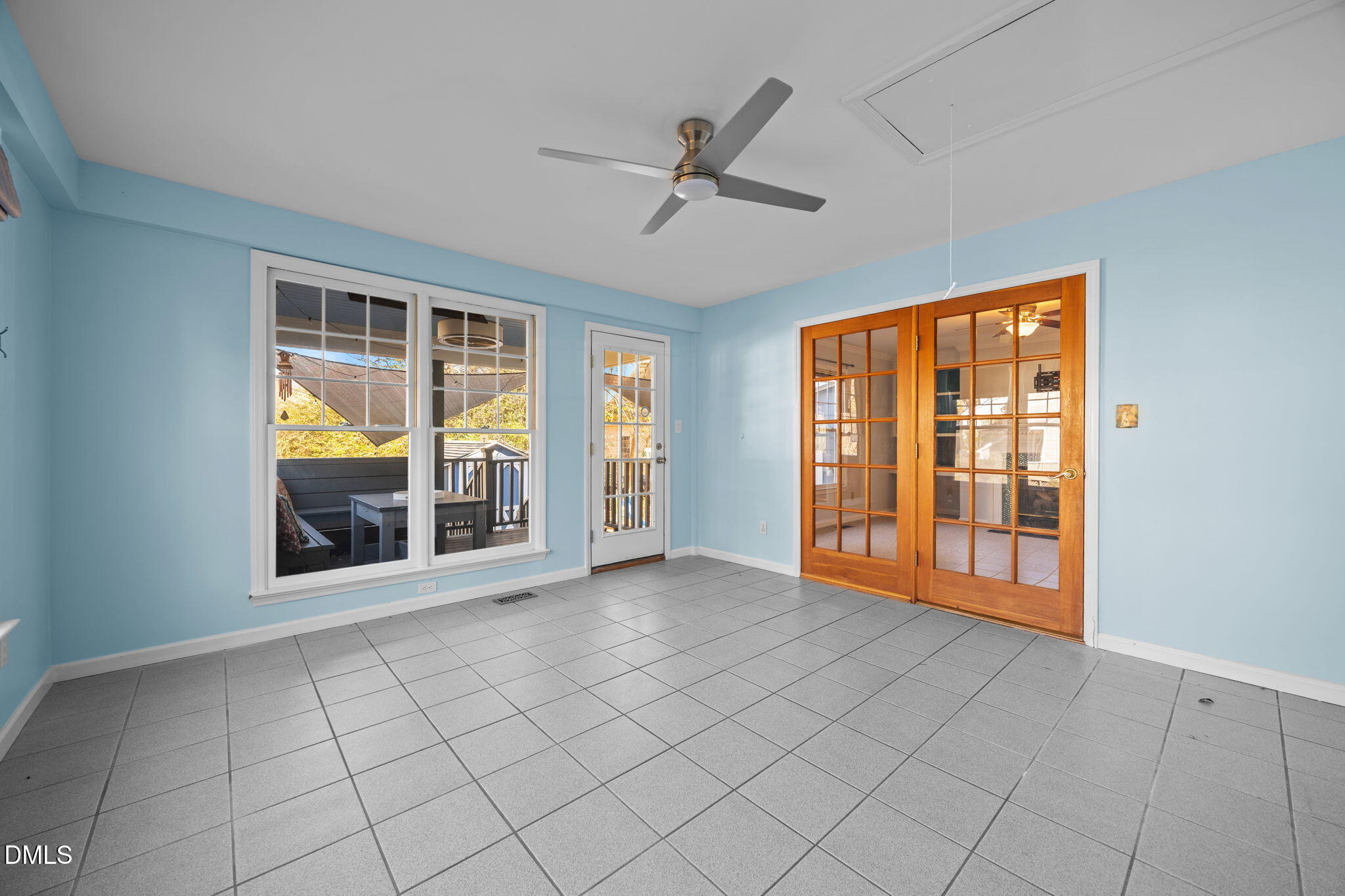 2214 Pathway Drive Chapel Hill, NC 27516 - Photo 10 of 34 a view of an empty room with window and chandelier fan