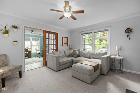 front view of a house with a chairs and table in the patio