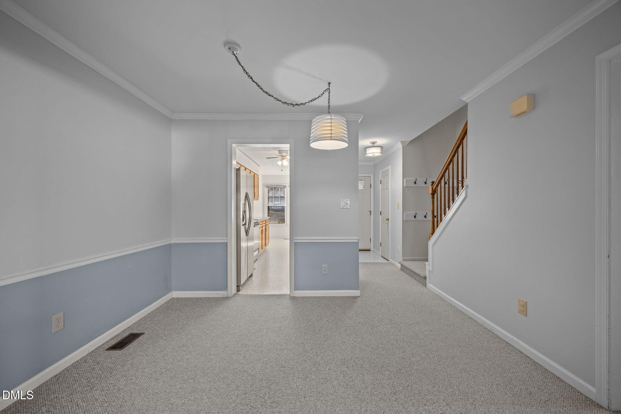 2214 Pathway Drive Chapel Hill, NC 27516 - Photo 12 of 34 a view of a room with stairs and a chandelier
