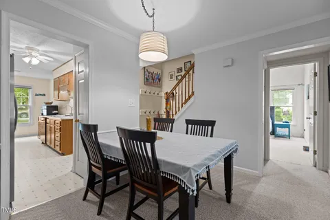 a view of a livingroom with workspace and a window