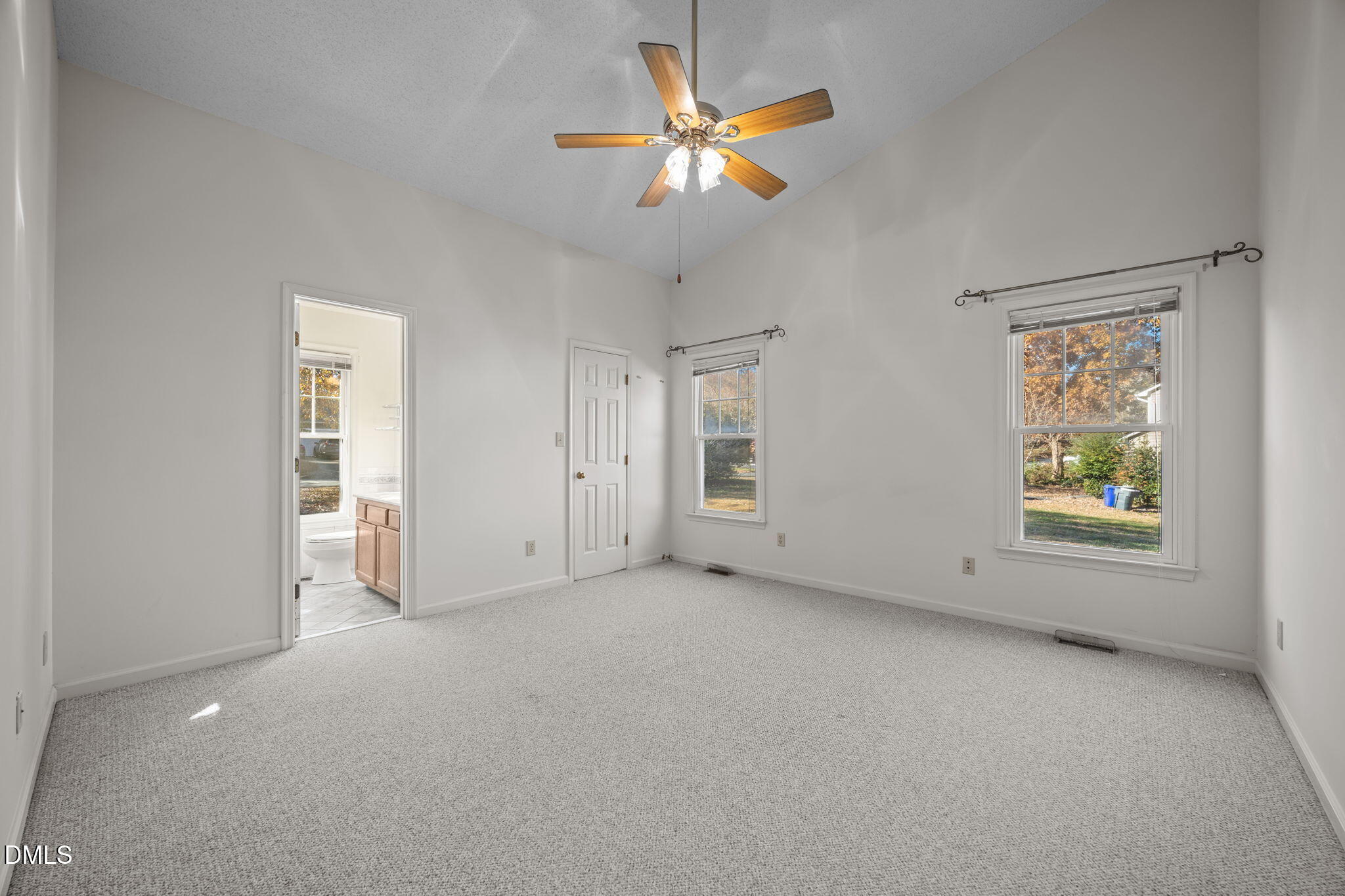 2214 Pathway Drive Chapel Hill, NC 27516 - Photo 19 of 34 an empty room with a window and a ceiling fan
