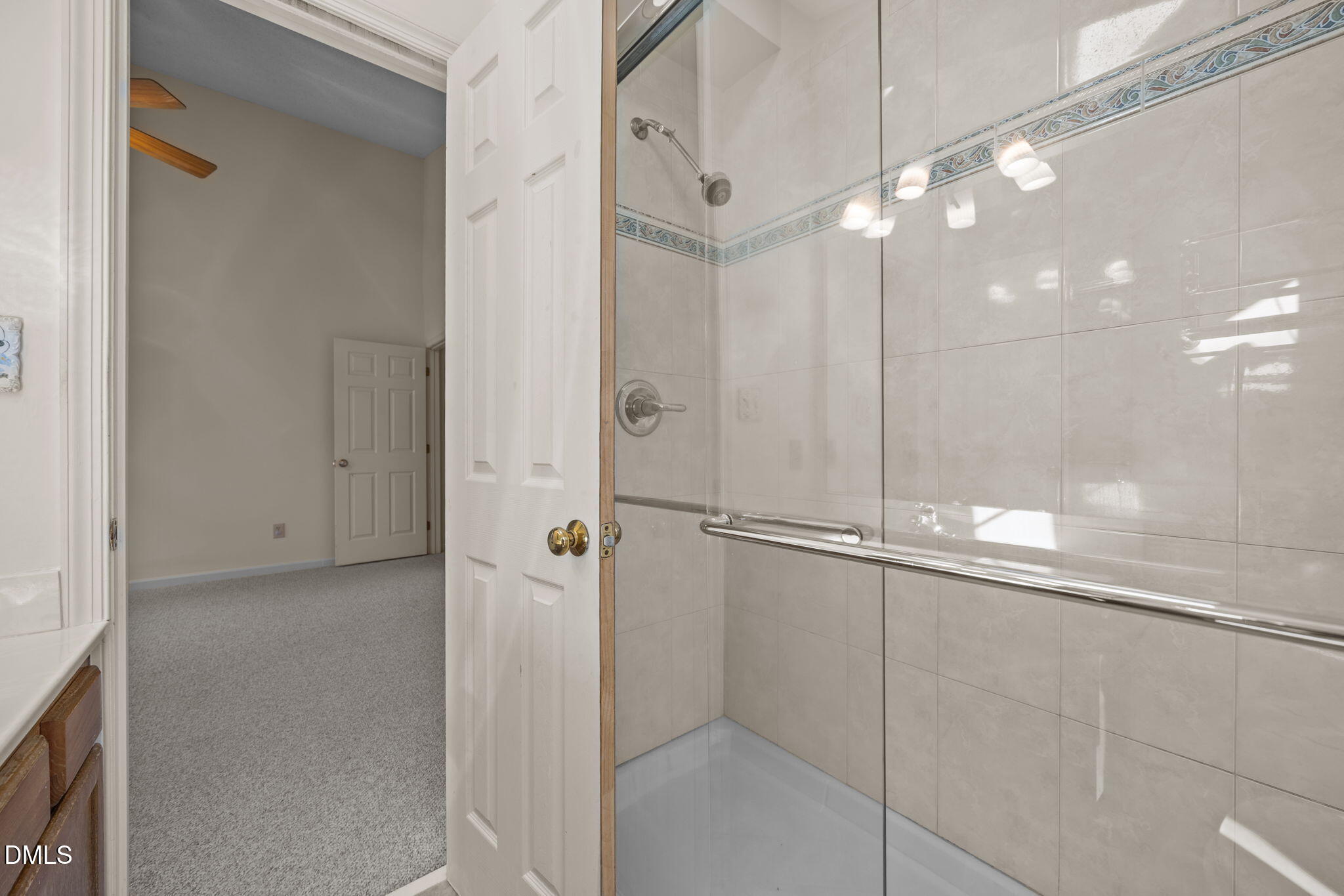 2214 Pathway Drive Chapel Hill, NC 27516 - Photo 21 of 34 a bathroom with a glass shower door