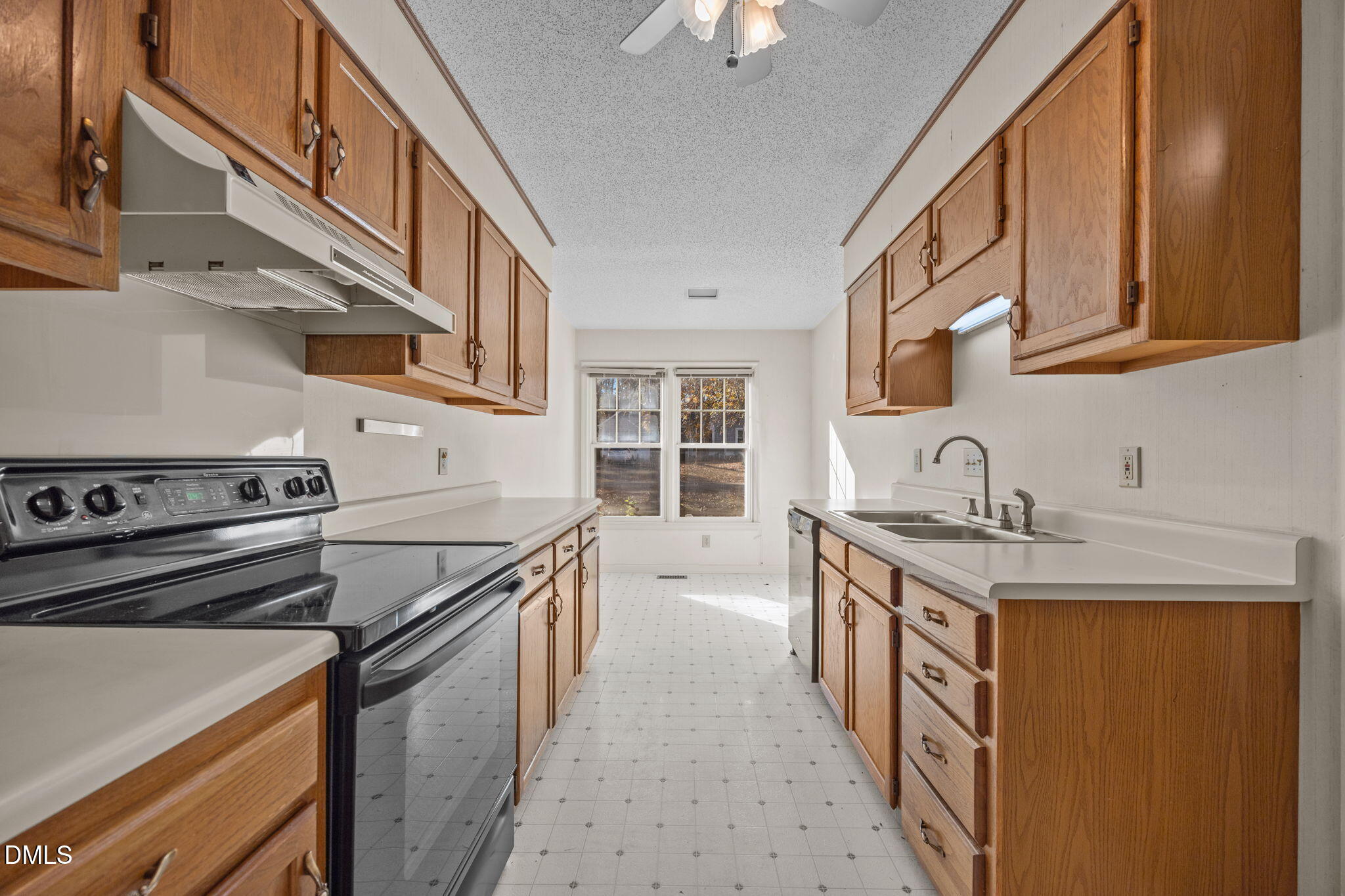 2214 Pathway Drive Chapel Hill, NC 27516 - Photo 7 of 34 a kitchen with a stove and a sink
