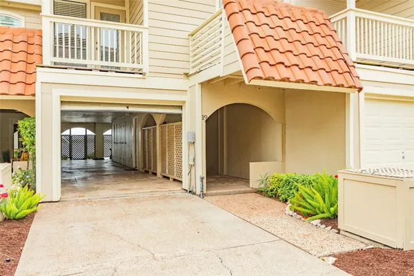 a front view of a house with a garden and entryway
