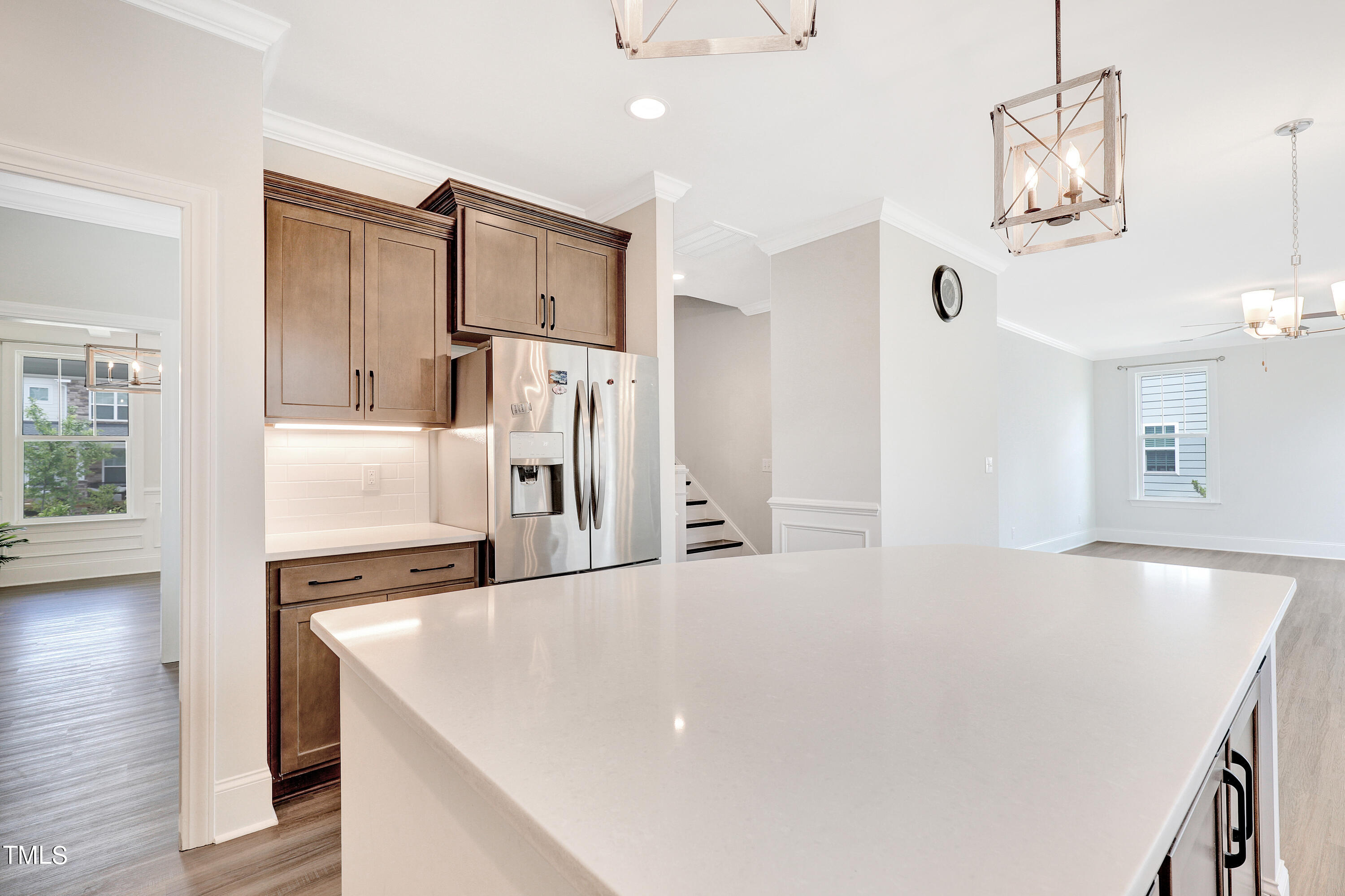 2153 Sweet Samson Street Wake Forest, NC 27587 - Photo 11 of 47 a kitchen with stainless steel appliances a refrigerator and a stove