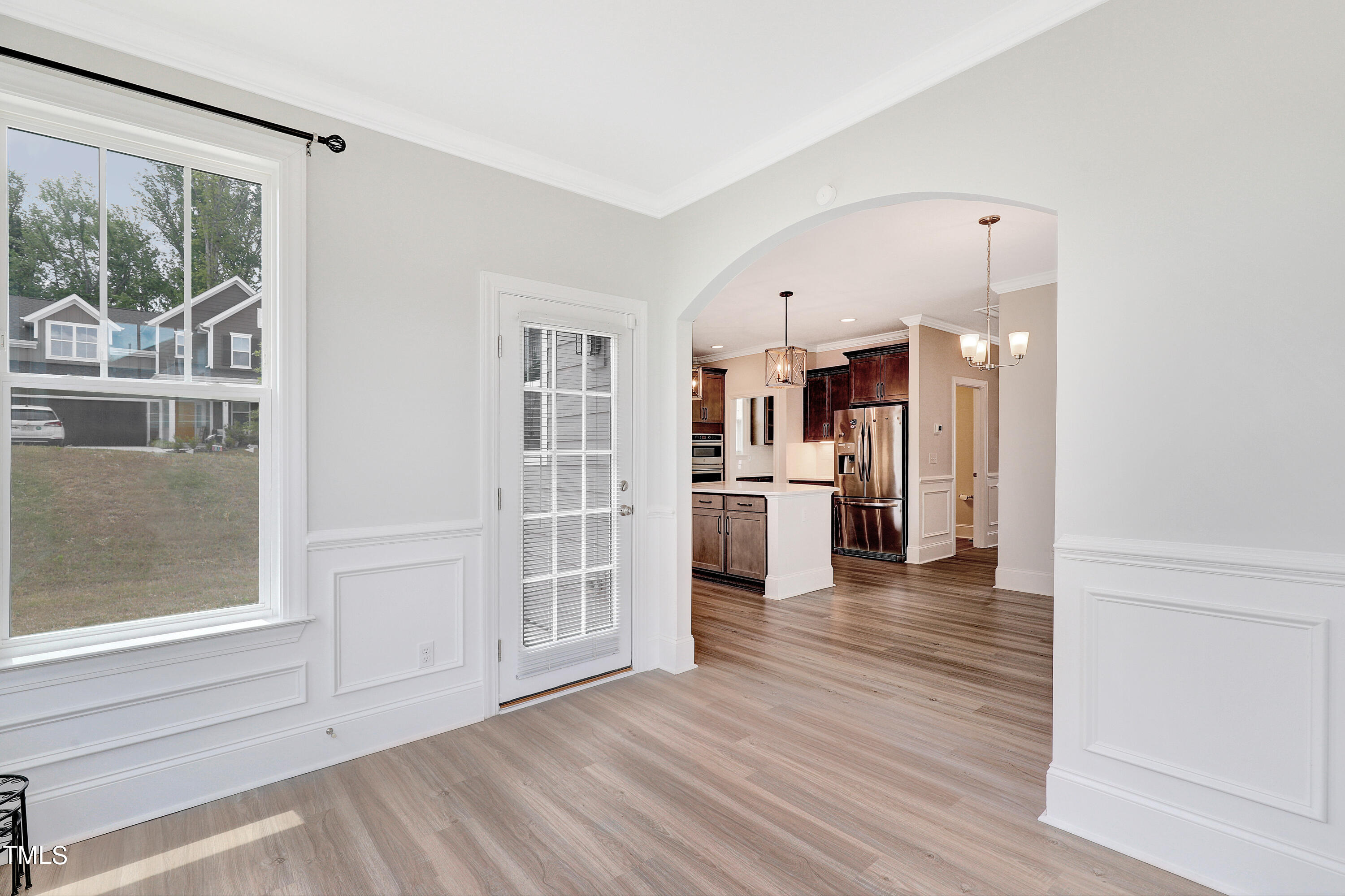 2153 Sweet Samson Street Wake Forest, NC 27587 - Photo 12 of 47 a view of a kitchen with wooden floor and a window
