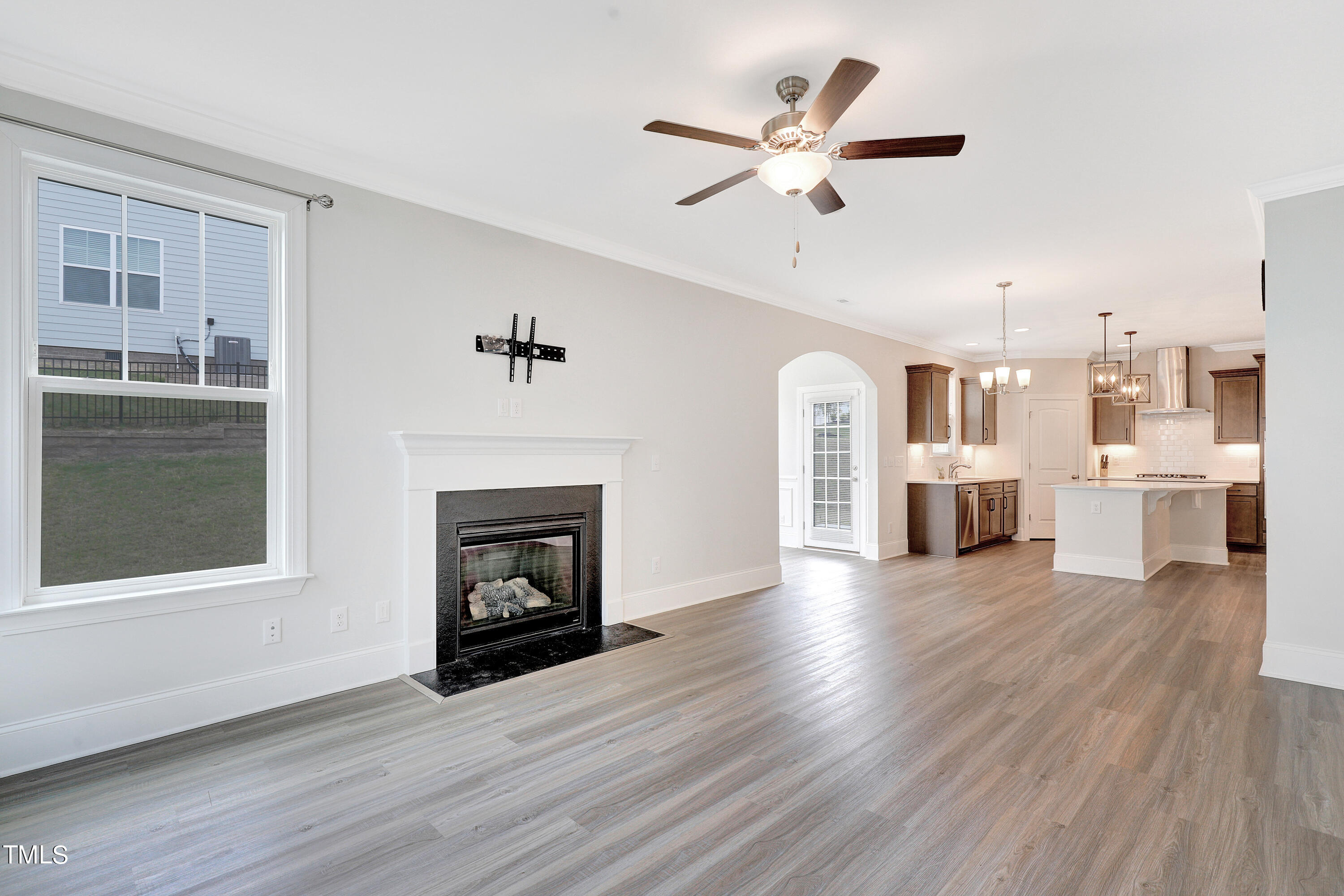 2153 Sweet Samson Street Wake Forest, NC 27587 - Photo 14 of 47 a view of a livingroom with a fireplace and wooden floor