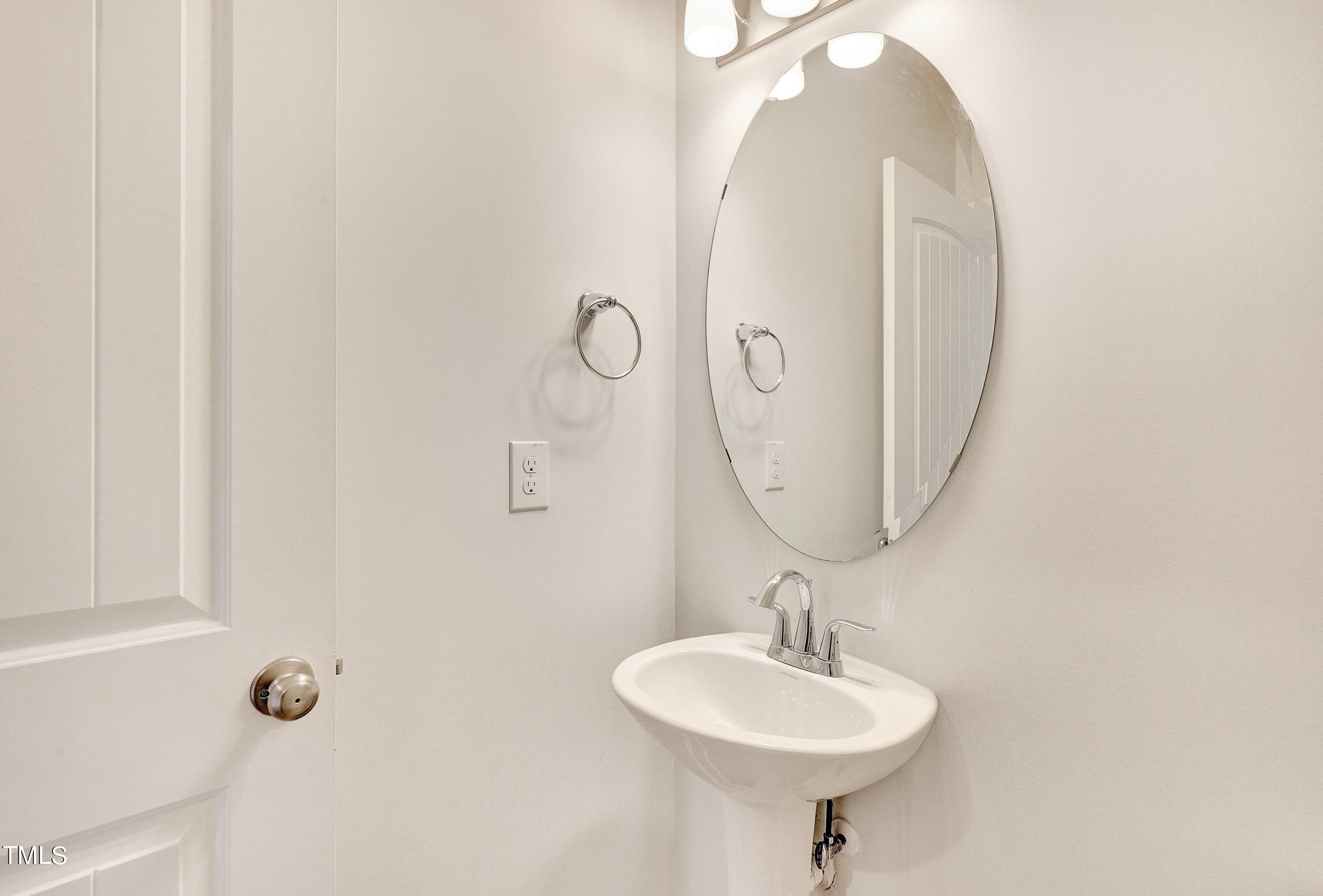 2153 Sweet Samson Street Wake Forest, NC 27587 - Photo 16 of 47 a bathroom with a sink a mirror and a shower