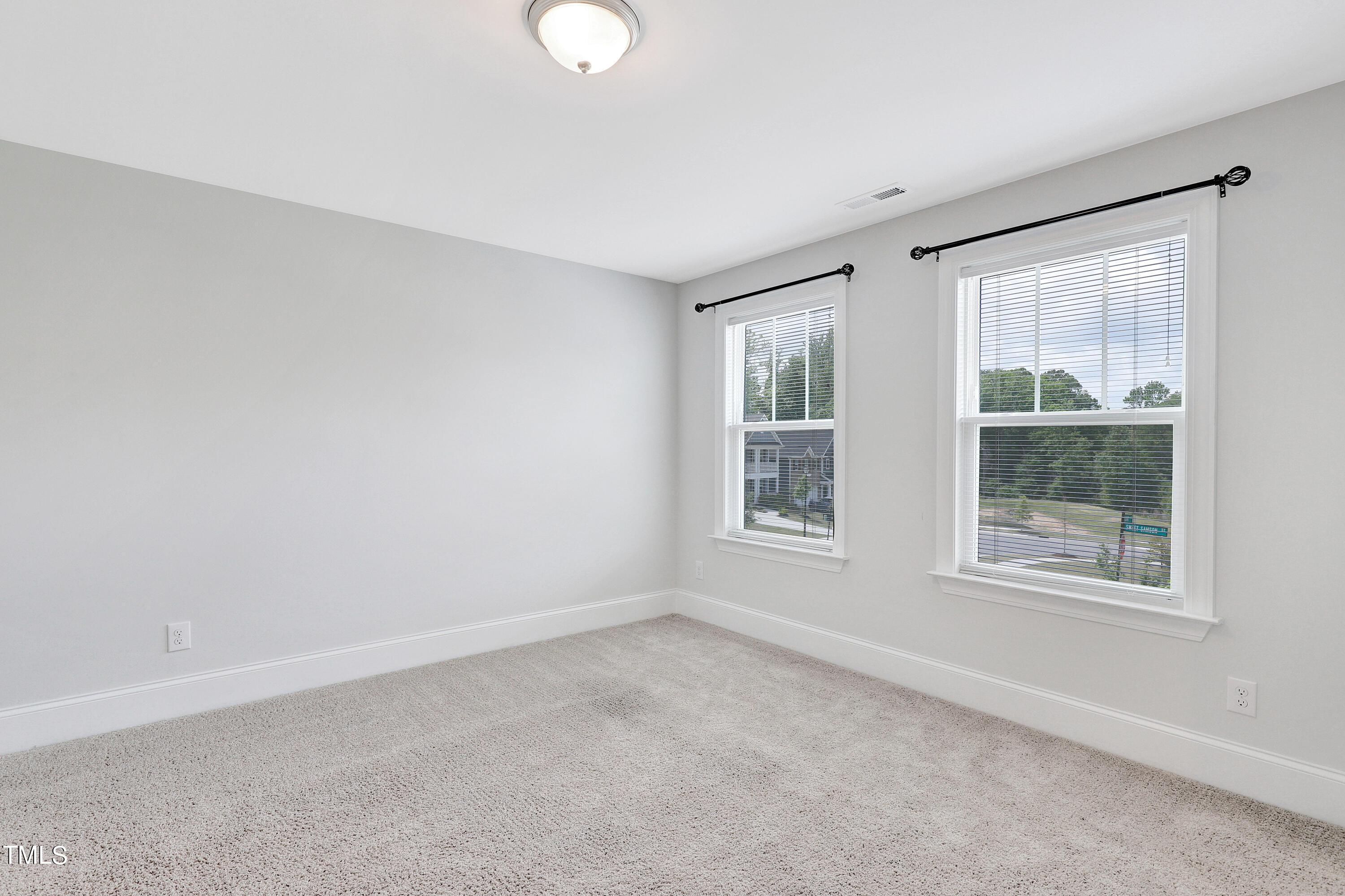 2153 Sweet Samson Street Wake Forest, NC 27587 - Photo 19 of 47 an empty room with windows