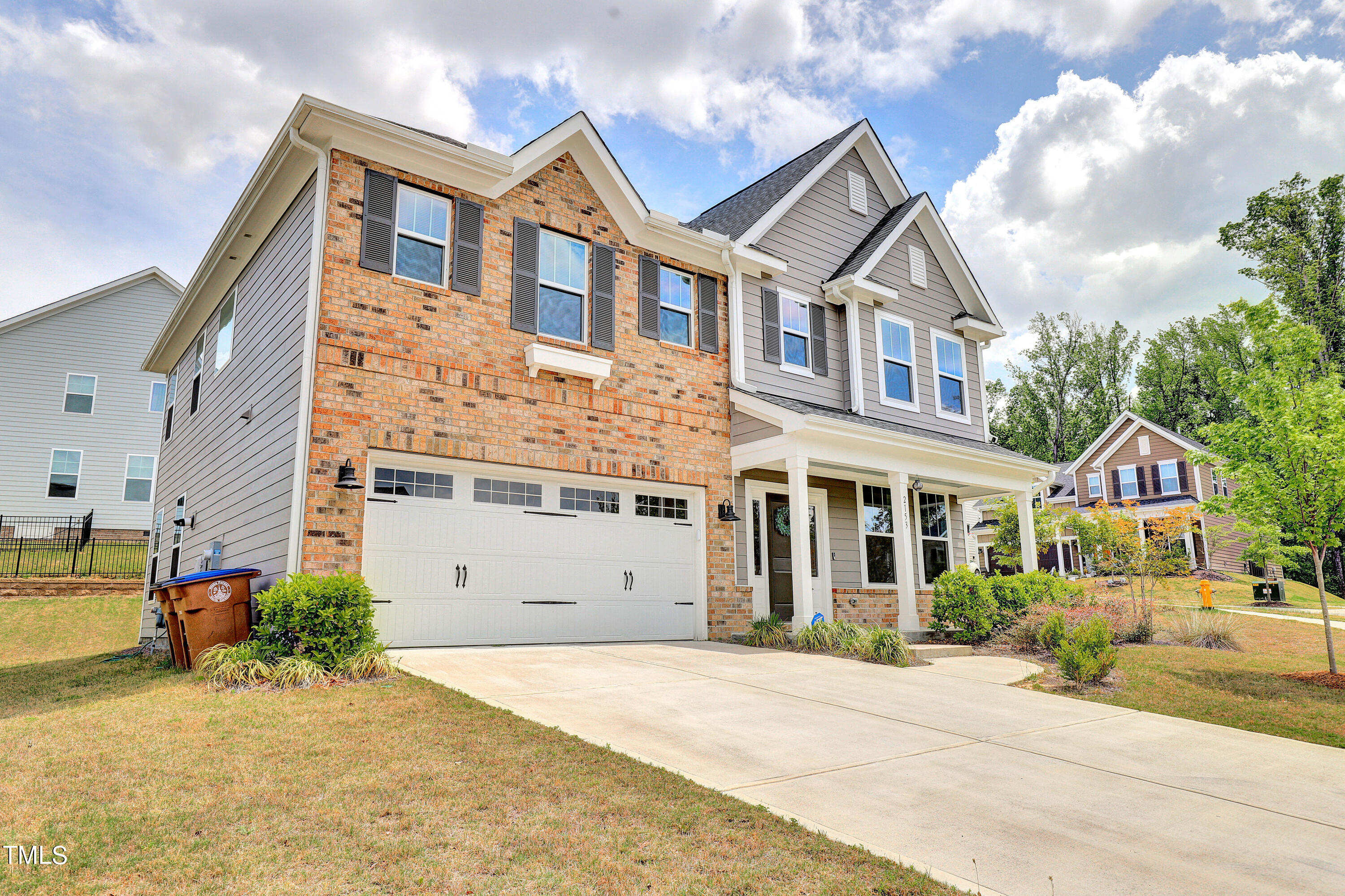 2153 Sweet Samson Street Wake Forest, NC 27587 - Photo 2 of 47 a front view of a house with a garden