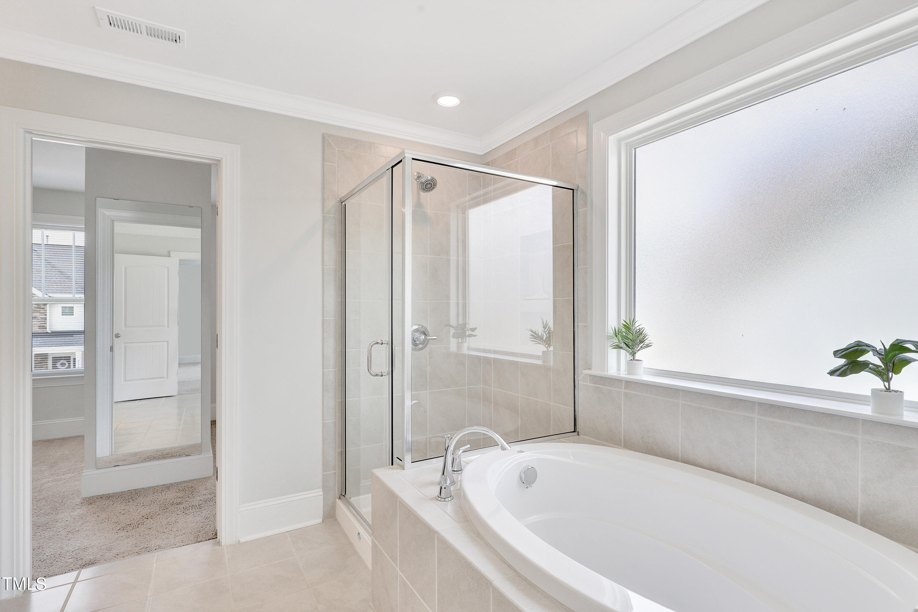 2153 Sweet Samson Street Wake Forest, NC 27587 - Photo 23 of 47 a bathroom with a bathtub and a shower
