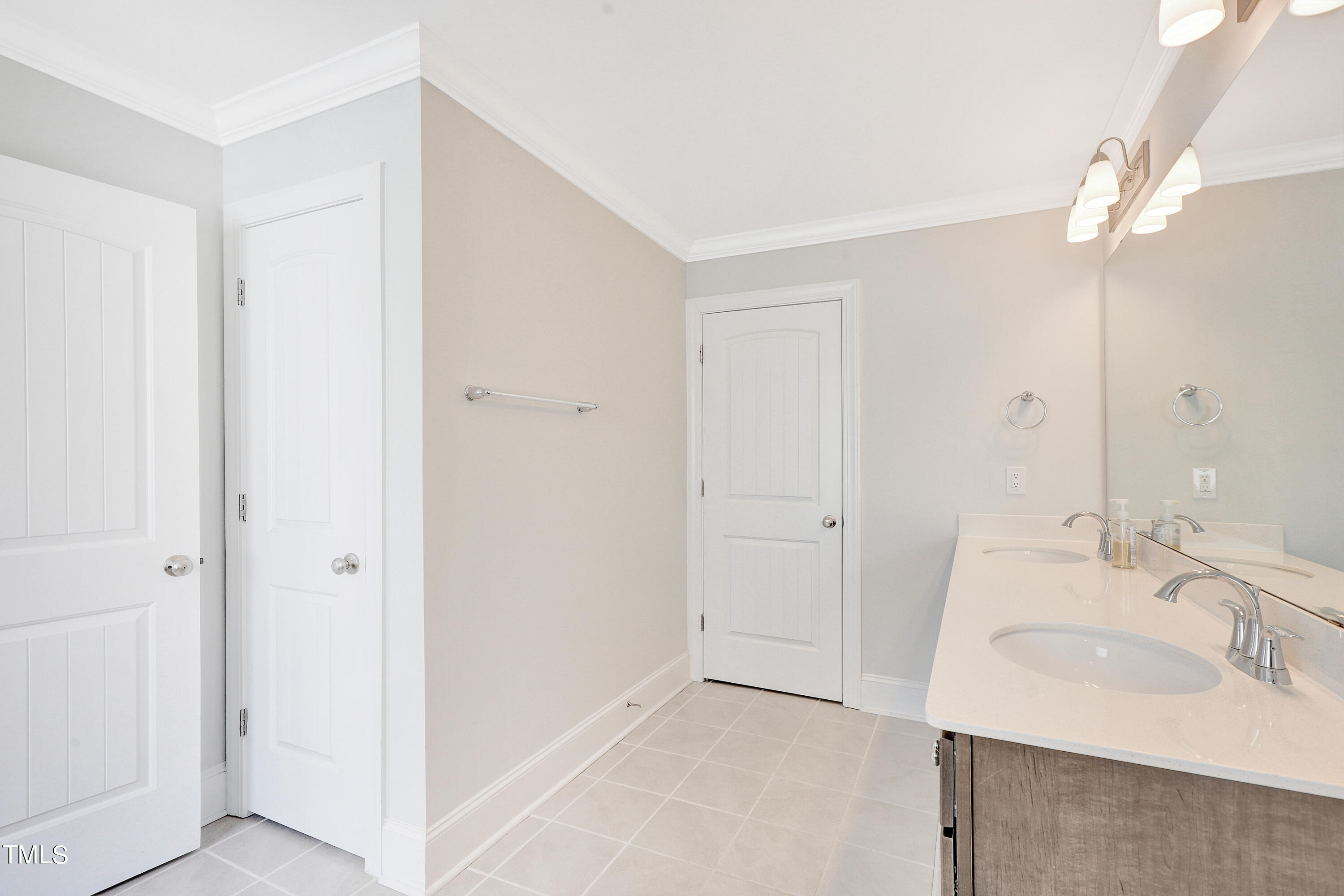 2153 Sweet Samson Street Wake Forest, NC 27587 - Photo 25 of 47 a bathroom with a sink and a mirror