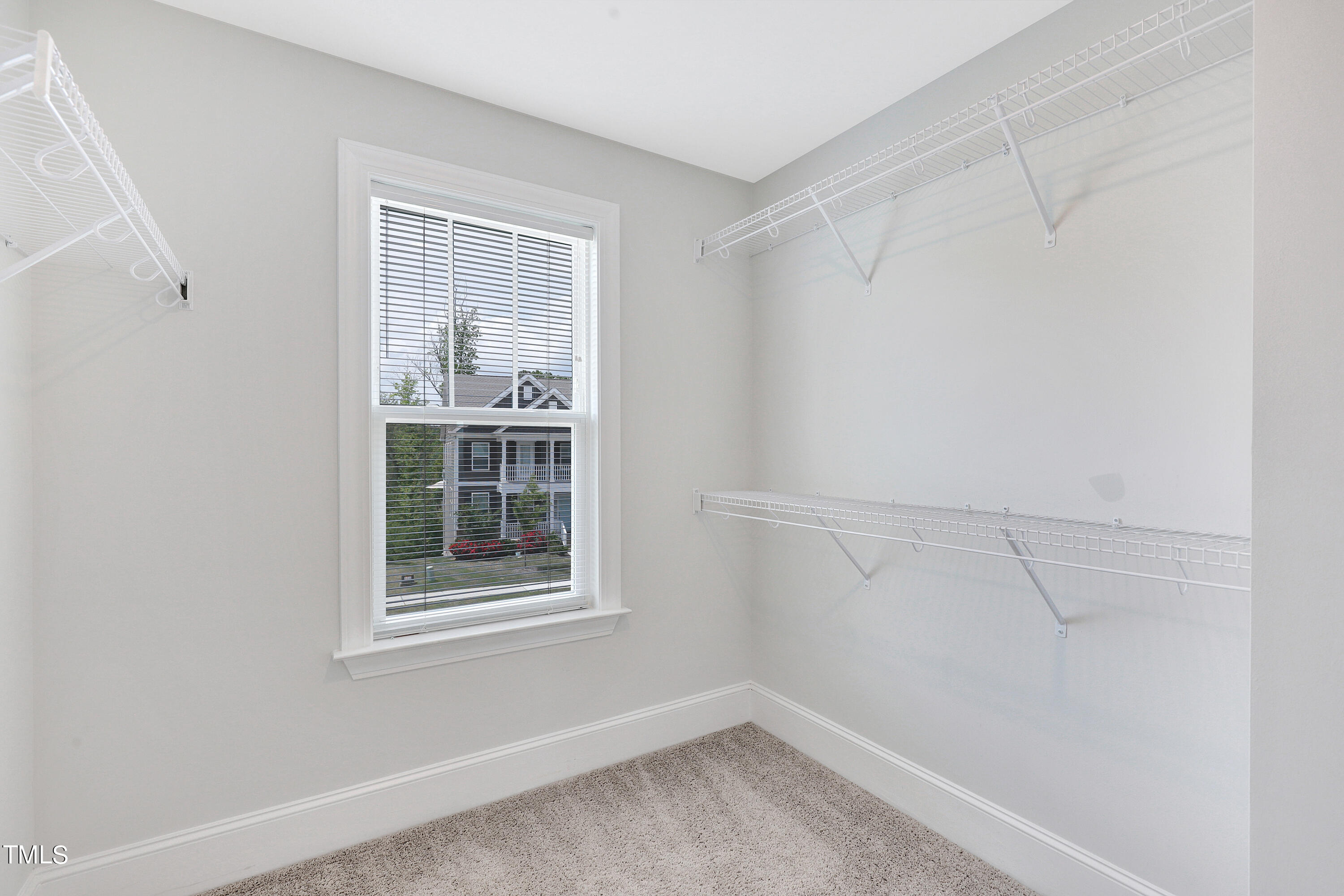2153 Sweet Samson Street Wake Forest, NC 27587 - Photo 27 of 47 a view of a room that has a window in it