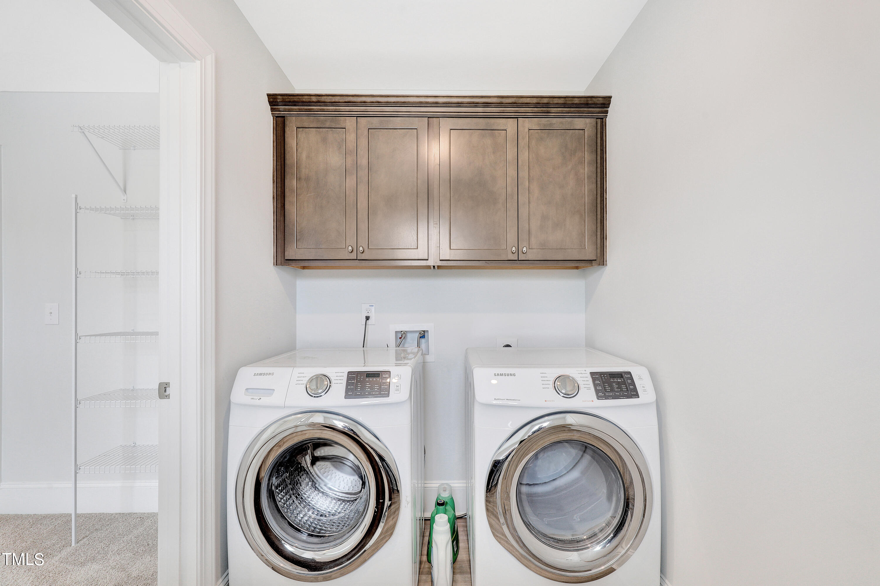 2153 Sweet Samson Street Wake Forest, NC 27587 - Photo 28 of 47 a view of storage and utility room with washer and dryer