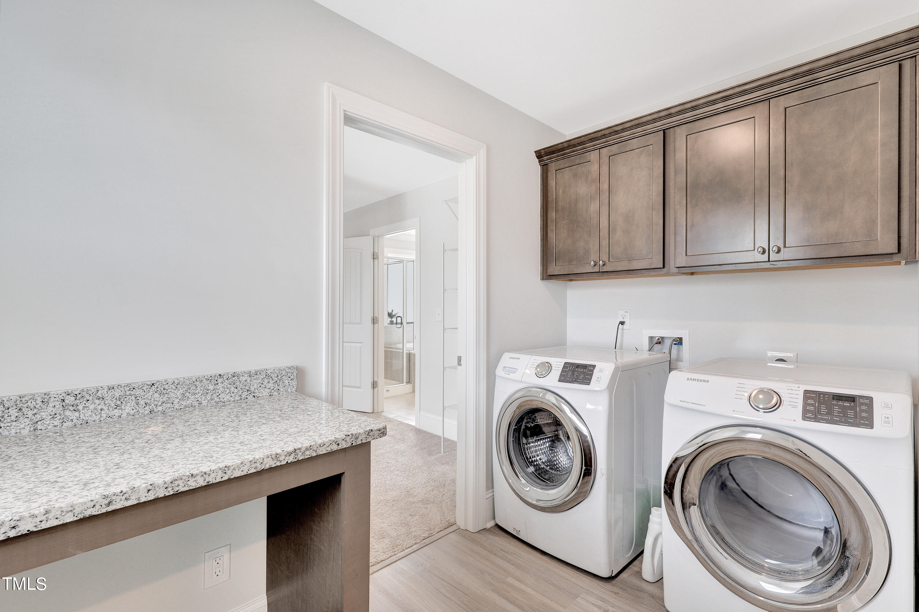 2153 Sweet Samson Street Wake Forest, NC 27587 - Photo 29 of 47 a view of storage and utility room with washer and dryer