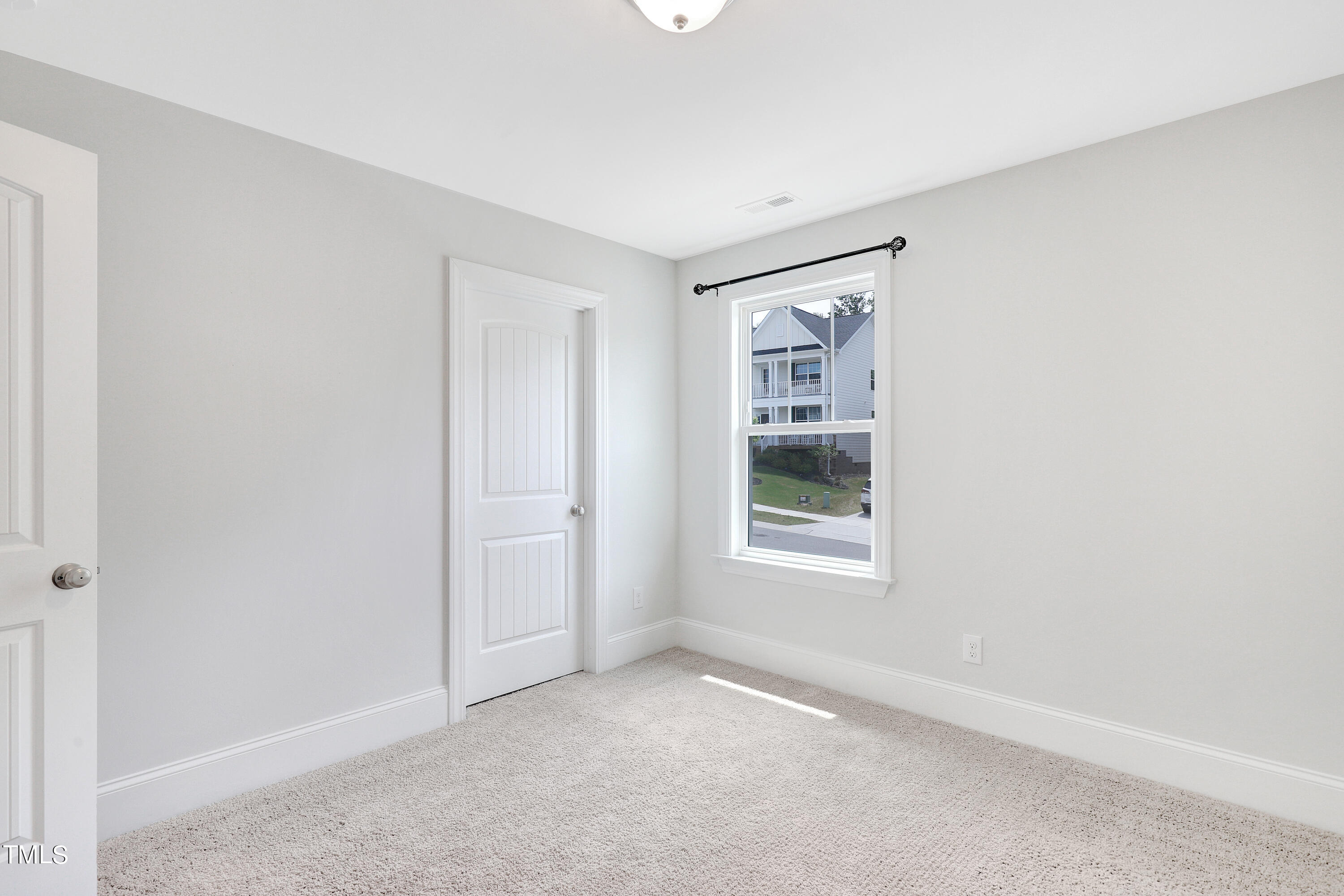 2153 Sweet Samson Street Wake Forest, NC 27587 - Photo 30 of 47 a view of an empty room with a window