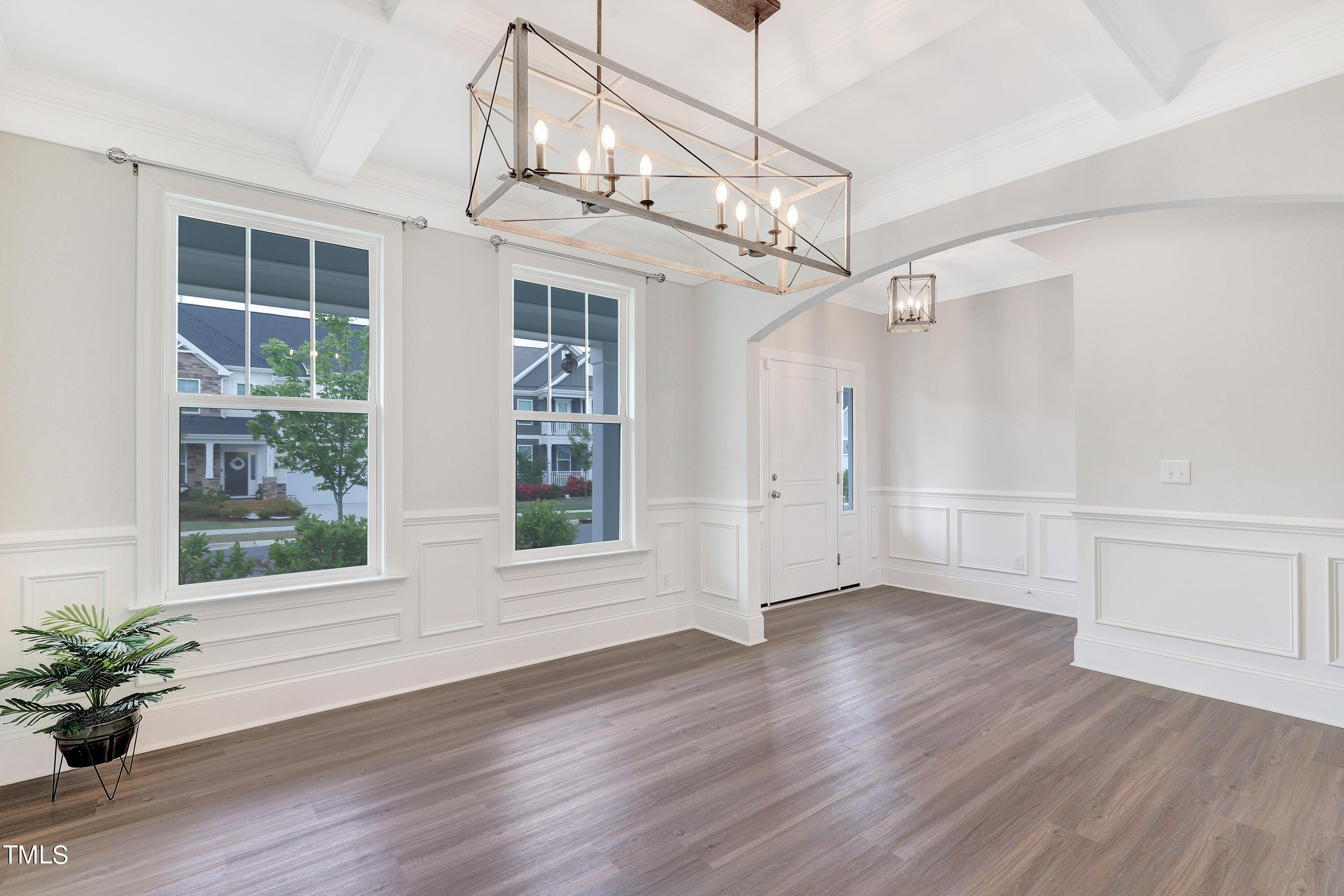 2153 Sweet Samson Street Wake Forest, NC 27587 - Photo 3 of 47 a view of a room with wooden floor a ceiling fan and windows