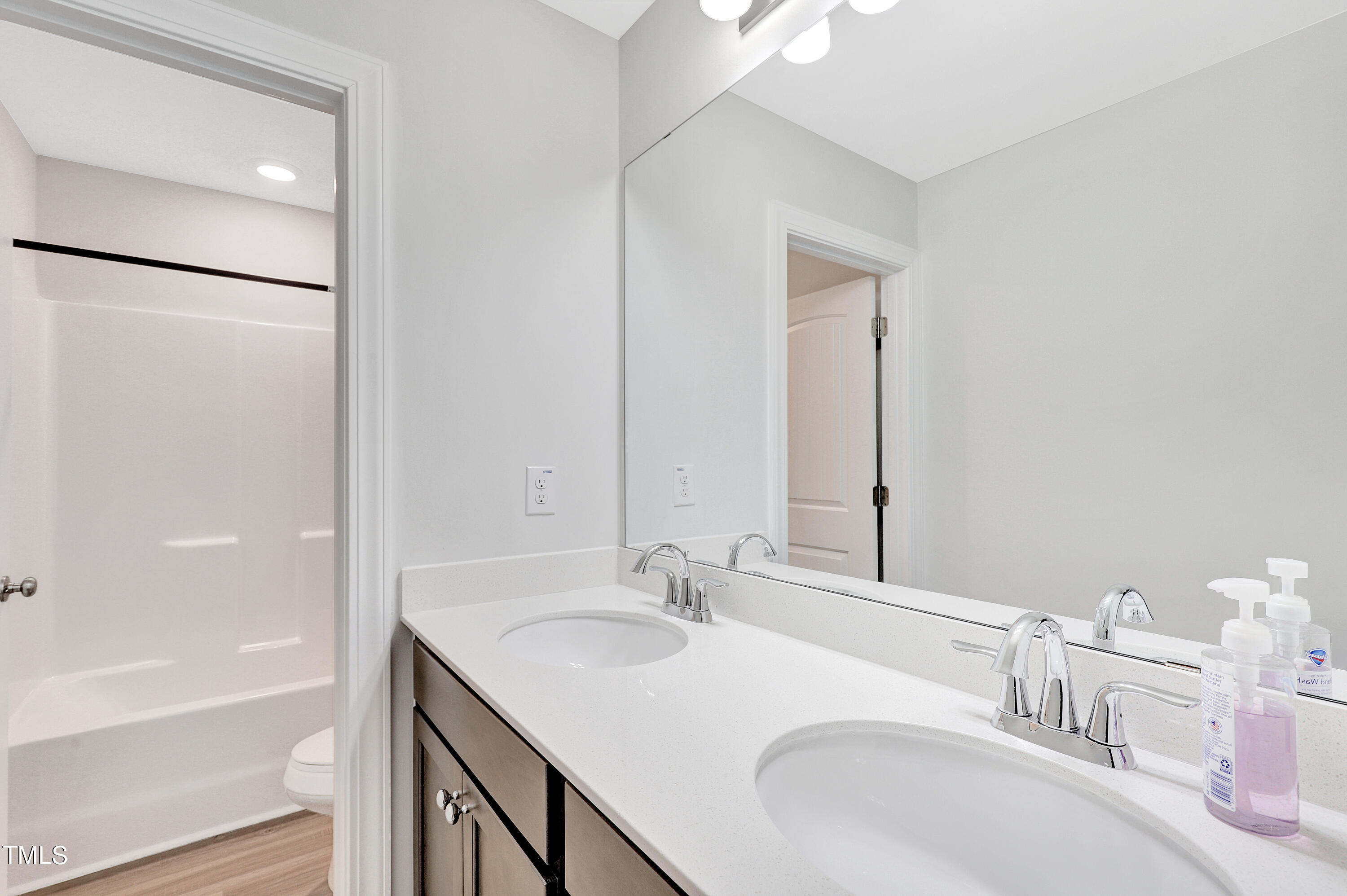 2153 Sweet Samson Street Wake Forest, NC 27587 - Photo 34 of 47 a bathroom with a granite countertop sink and a mirror
