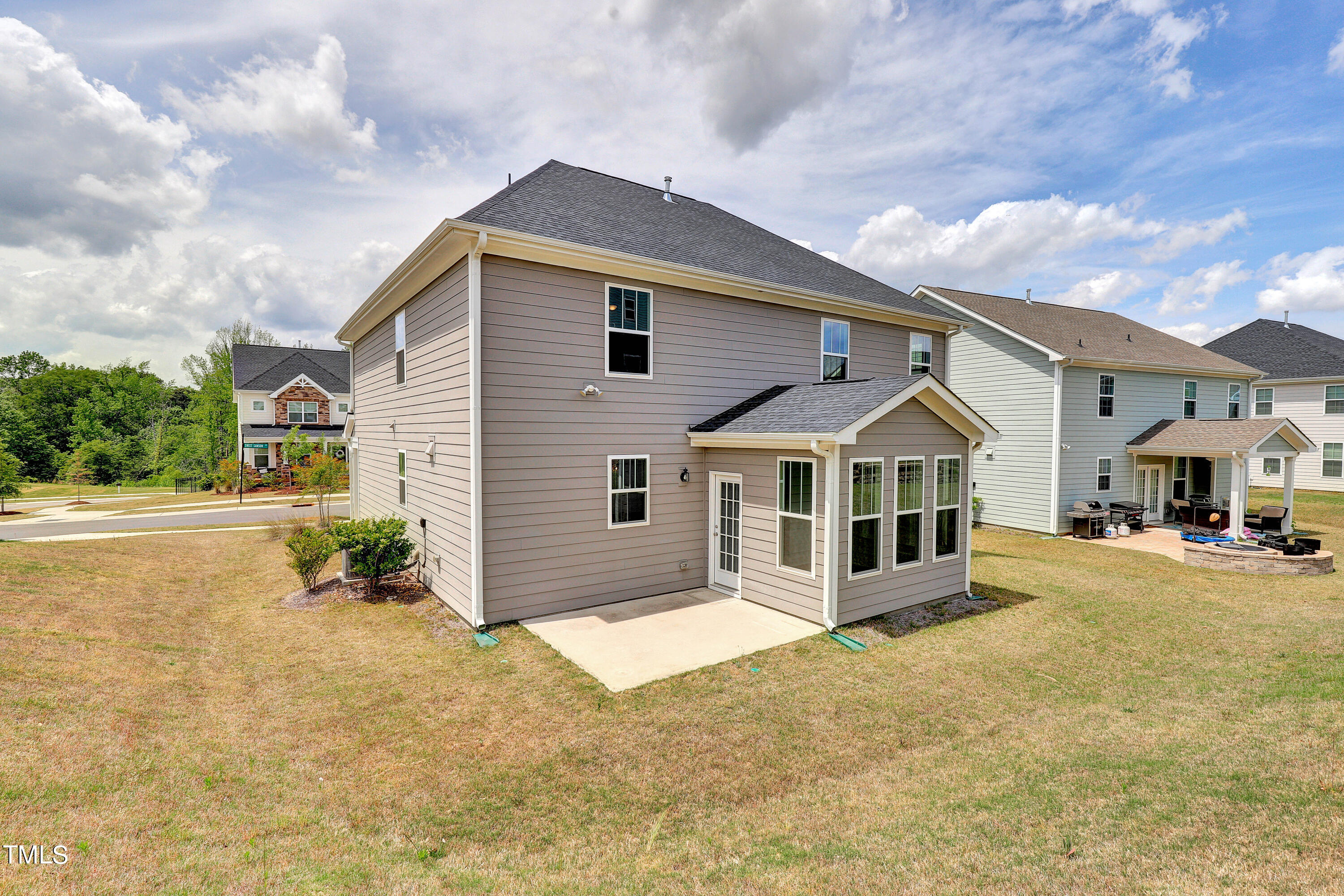 2153 Sweet Samson Street Wake Forest, NC 27587 - Photo 37 of 47 a front view of a house with a yard and garage