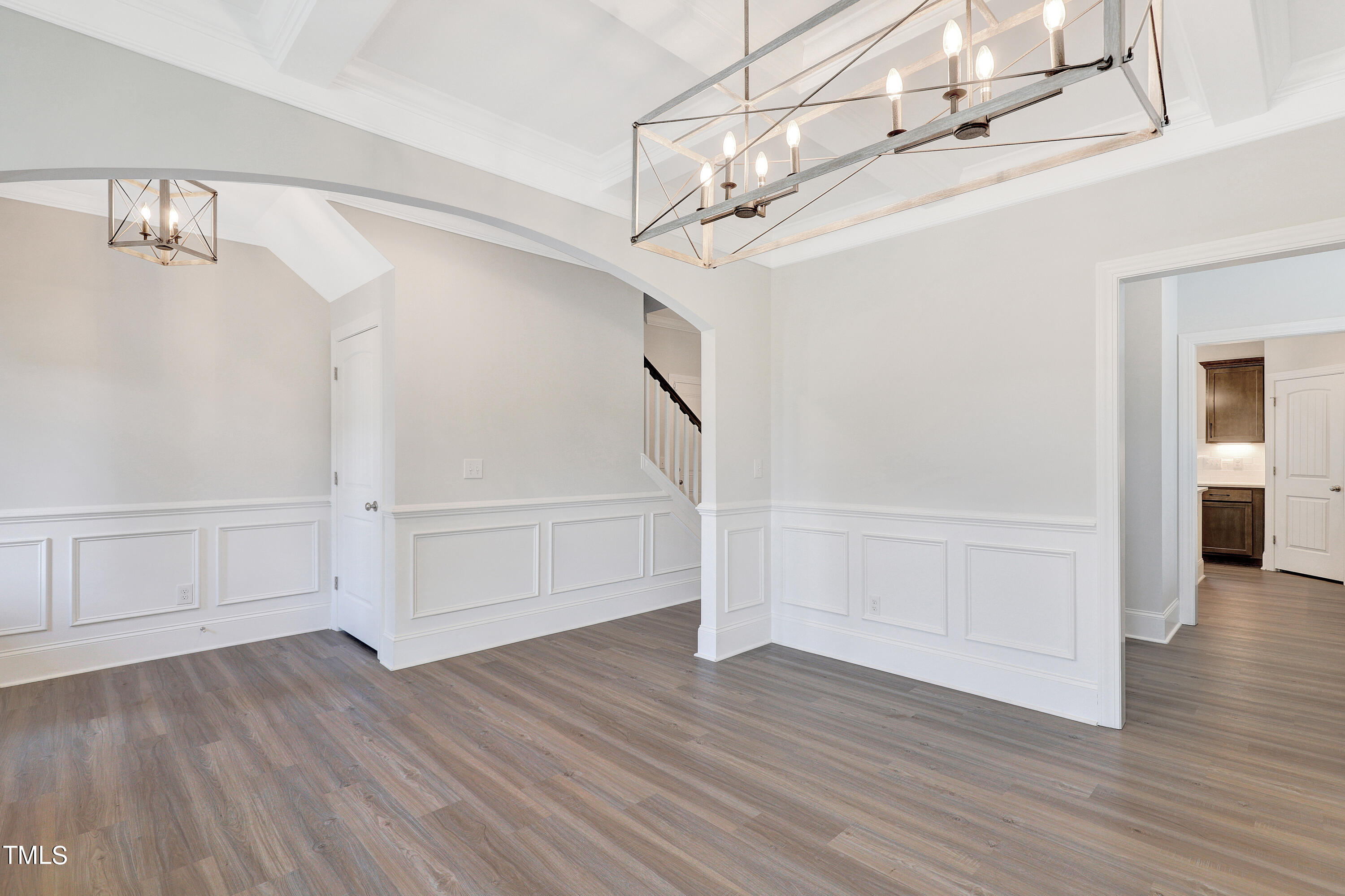 2153 Sweet Samson Street Wake Forest, NC 27587 - Photo 4 of 47 a view of a room with wooden floor and white walls