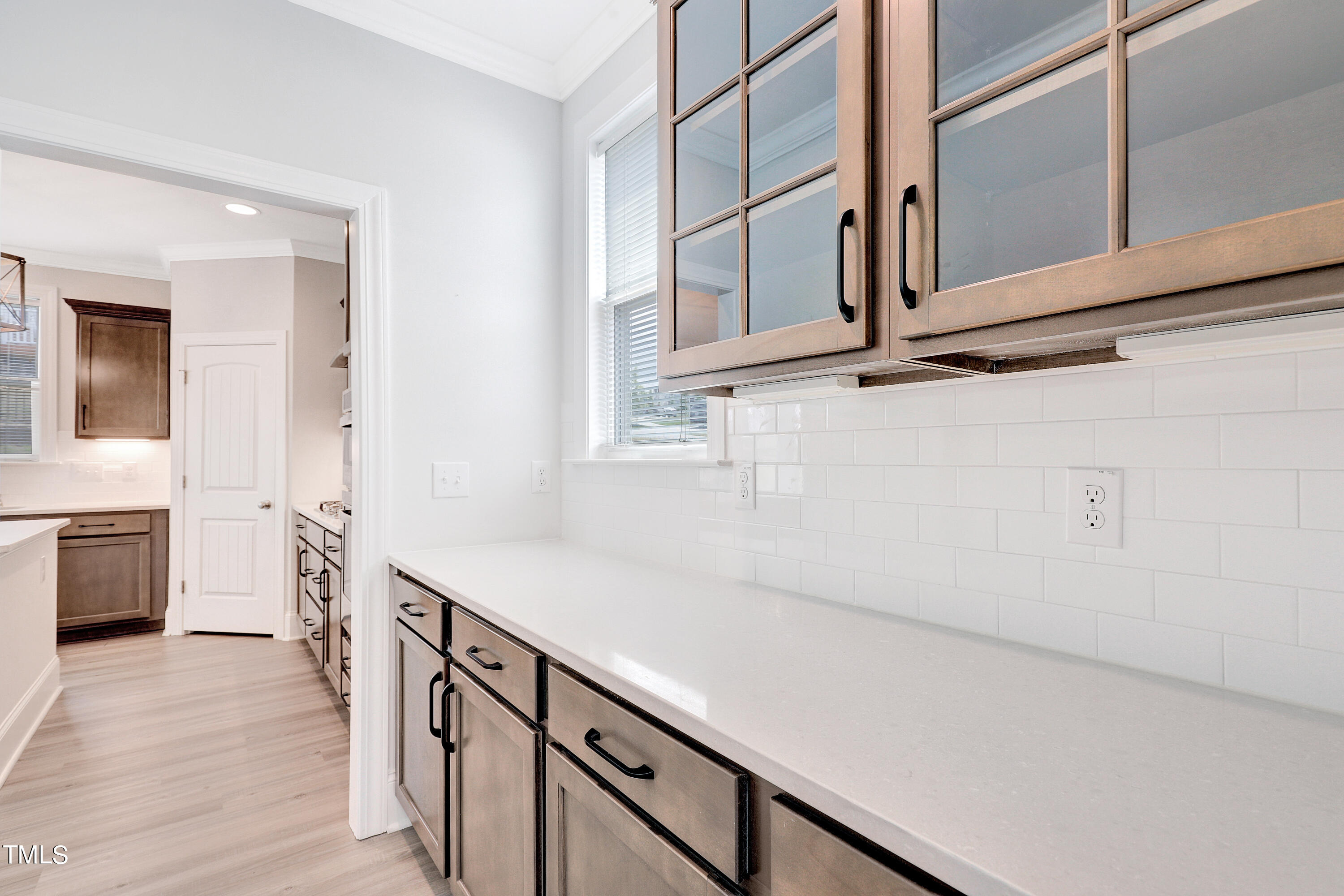 2153 Sweet Samson Street Wake Forest, NC 27587 - Photo 6 of 47 a kitchen with stainless steel appliances cabinets and wooden floor